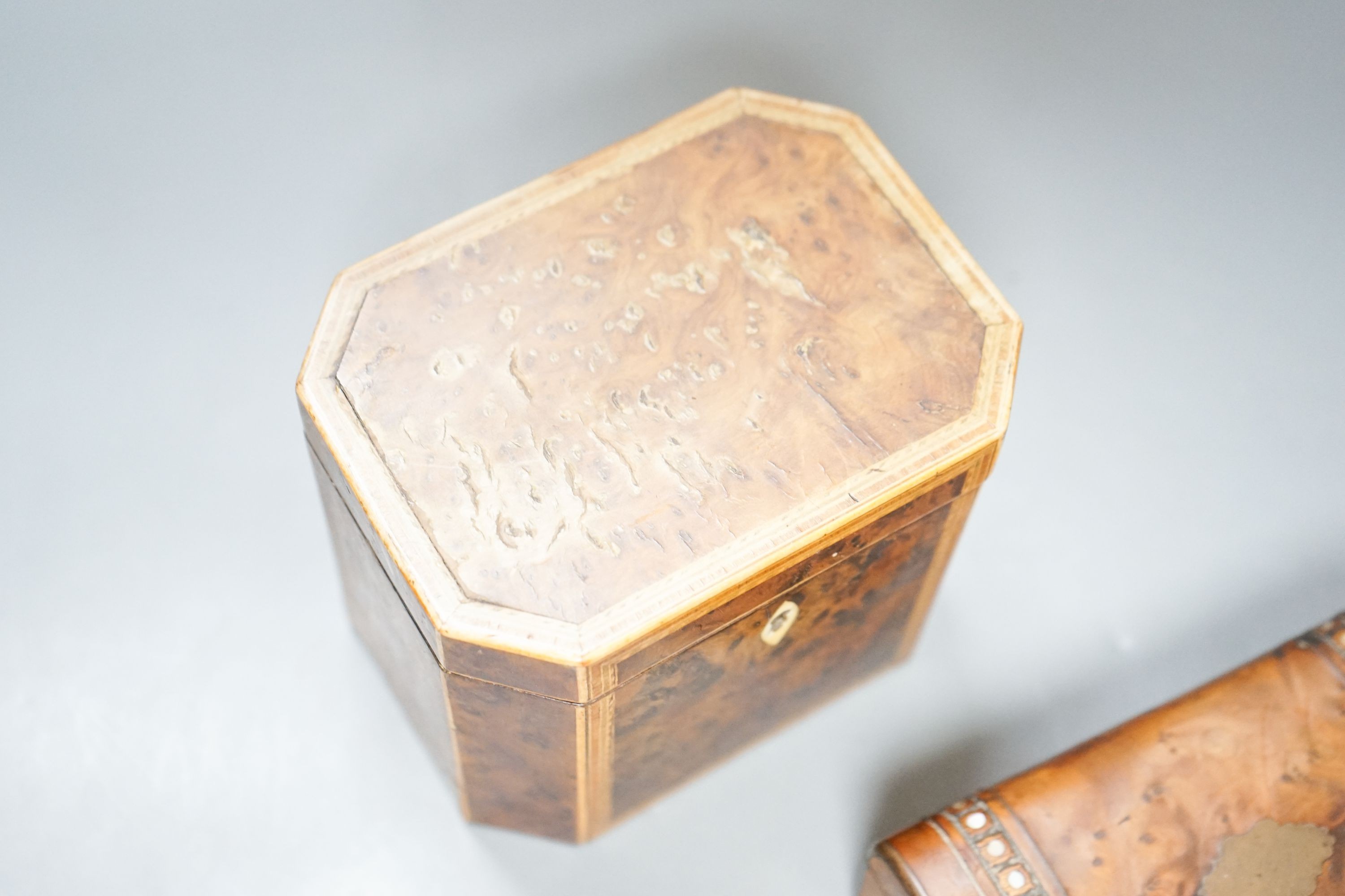 A George III burr yew and harewood, tulipwood and boxwood strung tea caddy, of octagonal form, 12.5cm and a small French yew jewellery casket